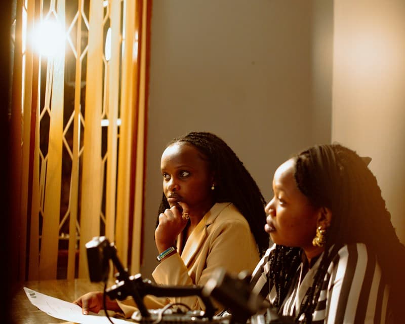 Two women listening closely during a legal consultation